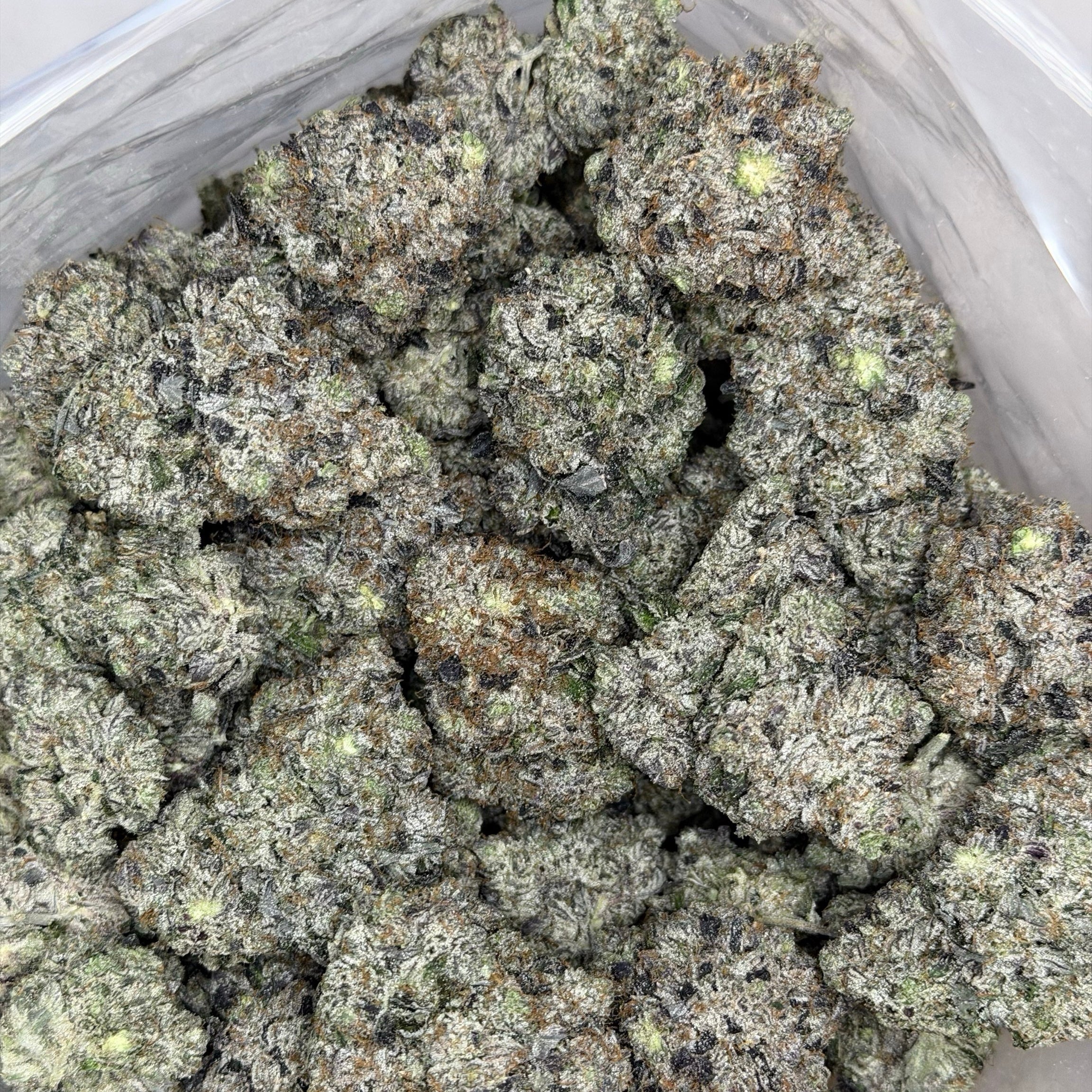Kraft Pink LSO AAAAA Indica close-up of frosty purple bud with loud pink gas terpenes