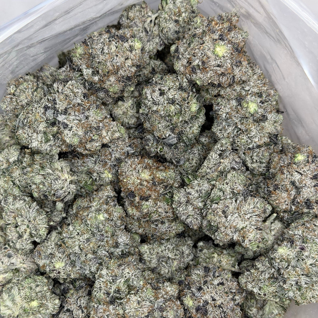 Kraft Pink LSO AAAAA Indica close-up of frosty purple bud with loud pink gas terpenes
