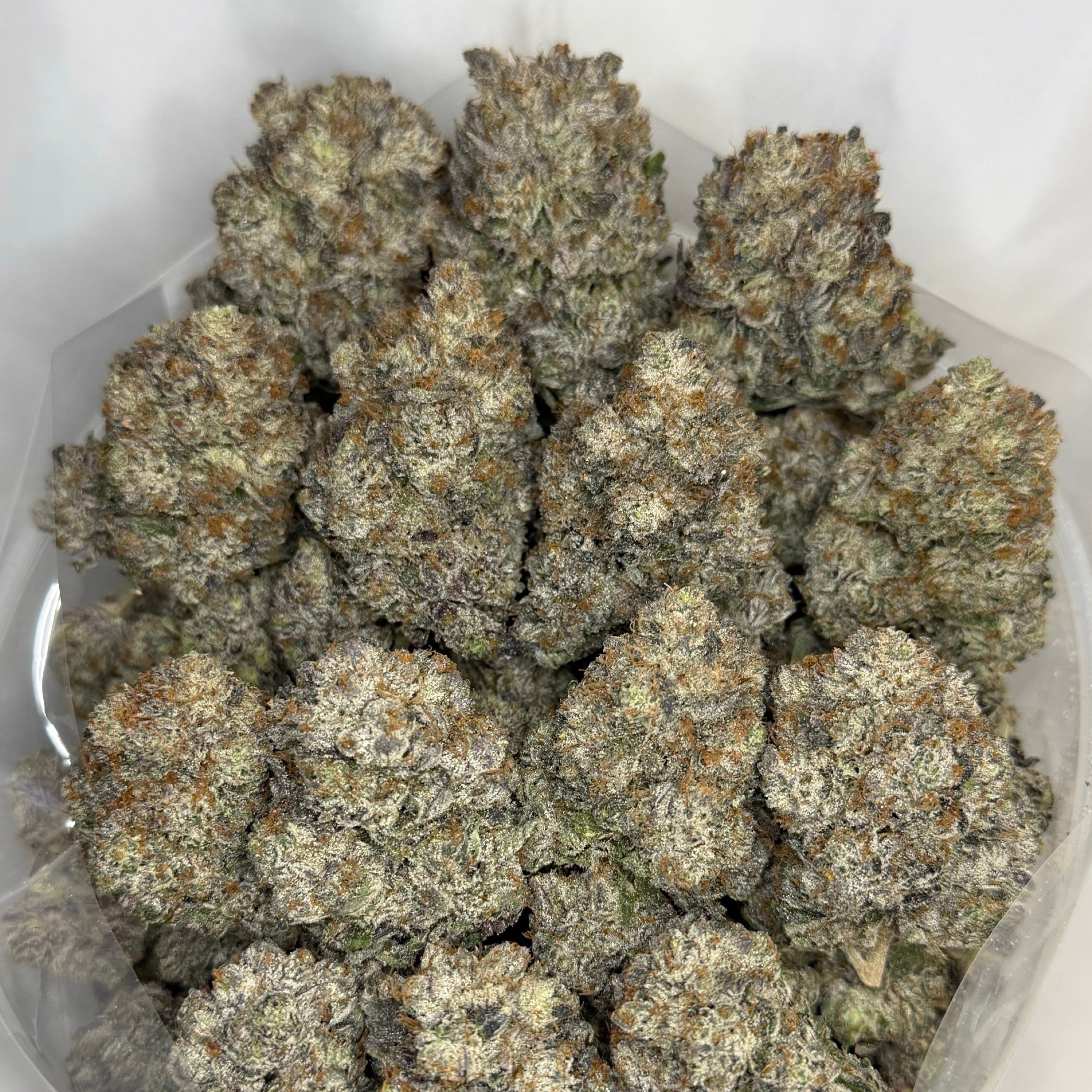 Pink Collector's Cut AAAAA Indica dense frosty purple buds premium craft flower