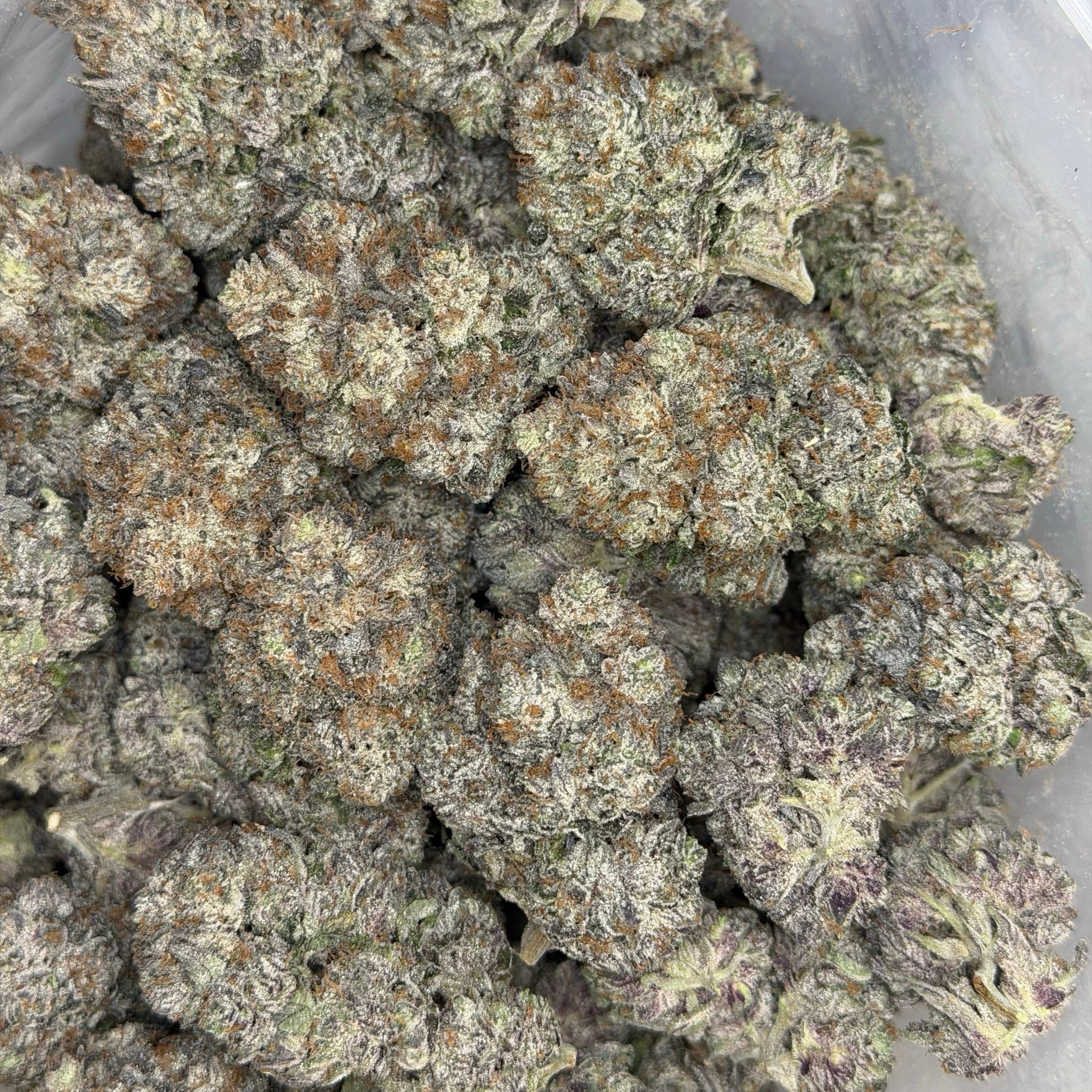 Pink Collector's Cut AAAAA Indica sticky resin-coated purple buds loud pink gas terpenes