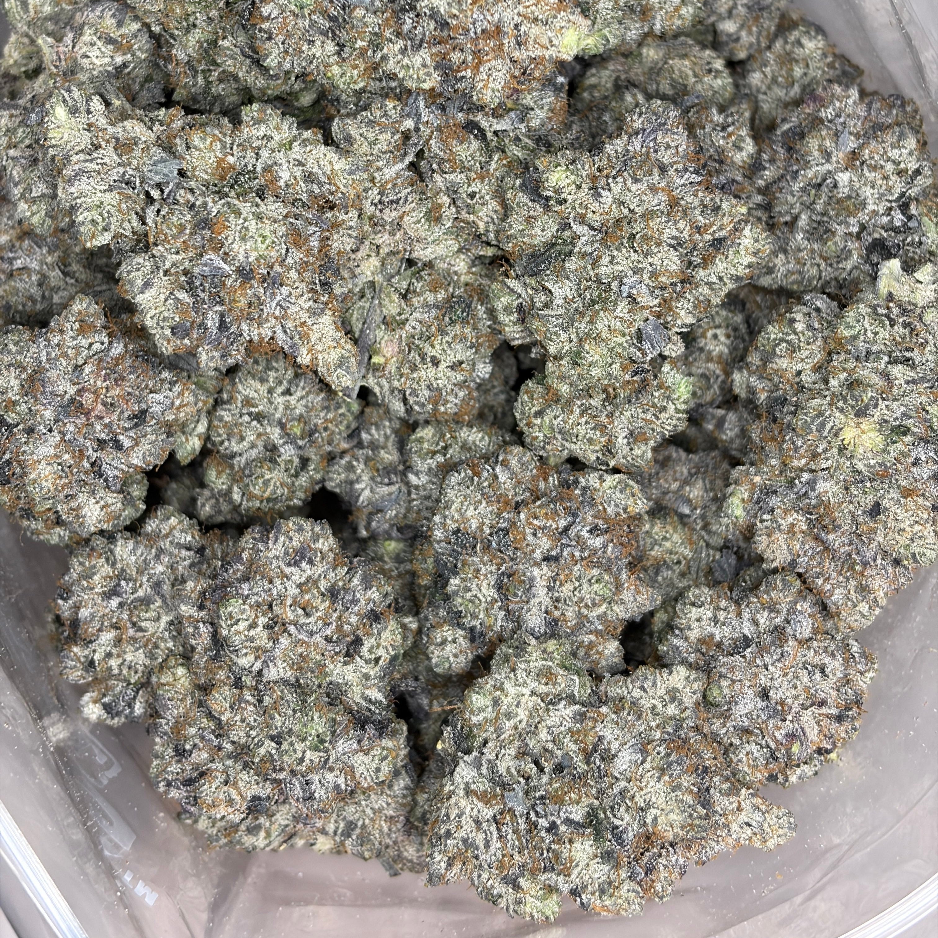 Close-up of Pink TruffleZ LSO package – luxury AAAAA gas indica strain with purple hues and trichomes – Toronto weed delivery